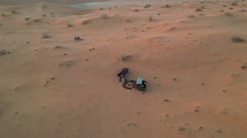 Traditional Arab gatherings in the desert, relaxation and enjoyment in the calm atmosphere, spending a pleasant vacation in the wilderness of the Kingdom of Saudi Arabia, a trip and a wild camping experience in the desert areas of the Great Nafud north of the city of Hail, the view of the soft golden sands, a tourist destination for adventure lovers.