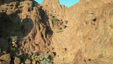 Natural rock formations in Saudi Arabia, drone photography of the desert nature and mountainous environment, rock formations in the mountains, peaks, and highlands, natural tourist spots and ancient historical archaeological sites for wild camping, a tourist destination for adventure lovers, a trip and wild camping in the desert north of Hail city.