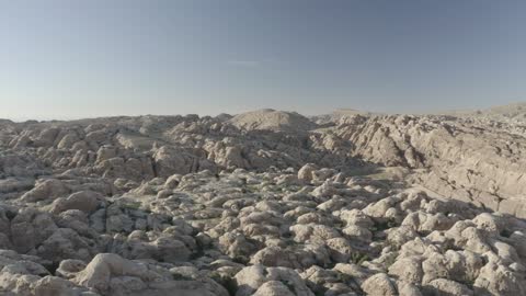 Aerial drone photography of the valleys and mountains in northern Saudi Arabia, rock formations, peaks, highlands, and terrain in mountainous areas.