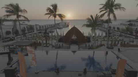 Famous tourist places and landmarks in the Kingdom of Saudi Arabia, clear waters and sunset views, aerial drone photography of Oya Beach Resort in Jeddah, a calm beach, the waterfront.