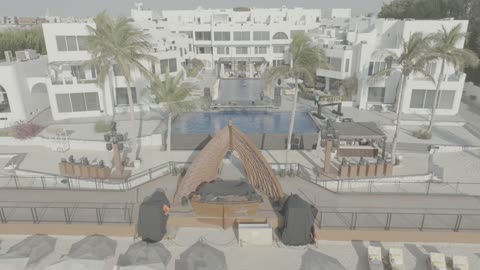 تصوير درون جوي لمنتجع اويا بيتش بجدة , شاطئ البحر هادئ، الواجهة البحرية، أماكن ومعالم سياحية مشهورة في المملكة العربية السعودية, مياه صافية وإطلالات نهارية