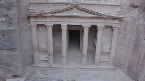 The rock formations and structures in the Hasma Desert, Wadi Rum in the city of Tabuk during the day, the desert environment and the peaks and mountain heights, tourist places in the Kingdom of Saudi Arabia, narrow valleys, natural arches, and slopes, nature background.