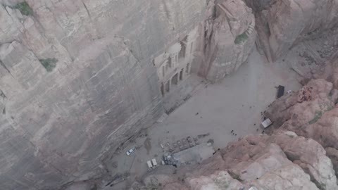 Narrow valleys, natural arches, and slopes, rock formations and structures in the Hasma Desert, Wadi Rum in the city of Tabuk during the day, the desert environment, peaks, and mountain elevations, tourist places in the Kingdom of Saudi Arabia, nature background.