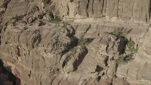 Narrow valleys, natural arches, and slopes, rock formations and structures in the Hasma Desert, Wadi Rum in the city of Tabuk during the day, the desert environment, peaks, and mountain elevations, tourist places in the Kingdom of Saudi Arabia, nature background.