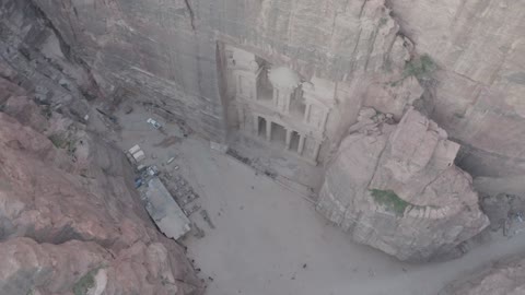 The rock formations and structures in the Hasma Desert, Wadi Rum in the city of Tabuk during the day, the desert environment and the peaks and mountain heights, tourist places in the Kingdom of Saudi Arabia, narrow valleys, natural arches, and slopes, nature background.