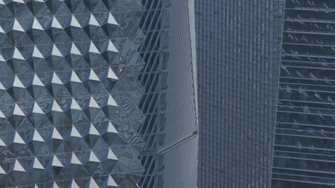 The architectural engineering art of financial towers and economic establishments in the capital, the growth and urban development of skyscrapers in the Kingdom of Saudi Arabia, aerial drone photography of the King Abdullah Financial Center "KAFD" at sunrise, and the famous landmarks of Riyadh.