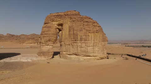 Aerial drone photography of the natural rock formations and structures in the city of Al-Ula, Saudi Arabia, historical archaeological tourist sites, desert nature, rocky mountains in the Al-Ula governorate, tourism in Saudi Arabia.