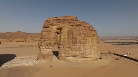 Aerial drone photography of the natural rock formations and structures in the city of Al-Ula, Saudi Arabia, historical archaeological tourist sites, desert nature, rocky mountains in the Al-Ula governorate, tourism in Saudi Arabia.