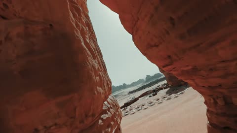 Aerial drone photography of the natural rock formations and structures in the city of Al-Ula in the Kingdom of Saudi Arabia, historical archaeological tourist sites, desert nature, rocky mountains in the Al-Ula governorate, tourism in Saudi Arabia.