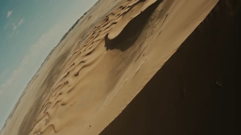 The hills and sand dunes in the Empty Quarter desert, the natural landscapes in the desert environment of the Kingdom of Saudi Arabia, formations of soft golden sands, the backdrop of the desert nature.