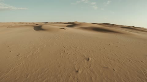 The landscapes in the desert environment of the Kingdom of Saudi Arabia, formations of soft golden sands, hills and sand dunes in the Empty Quarter desert, the backdrop of the desert nature.