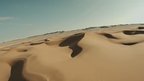 The landscapes in the desert environment of the Kingdom of Saudi Arabia, formations of soft golden sands, hills and sand dunes in the Empty Quarter desert, the backdrop of the desert nature.