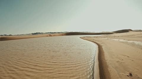 Soft golden sand formations, hills and sand dunes in the Empty Quarter desert, natural landscapes in the desert environment of the Kingdom of Saudi Arabia, desert nature background.