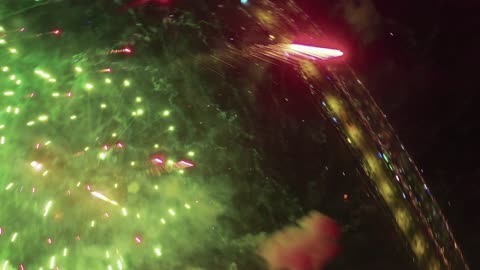 Happy holidays and occasions, towers and skyscrapers, aerial drone photography to celebrate fireworks at night, nighttime fireworks events.