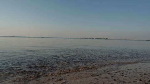 Half Moon Beach in the city of Khobar in Dammam, the stunning sunrise view over the beach, the nature in the city of Khobar in the Kingdom of Saudi Arabia, tourist attractions.