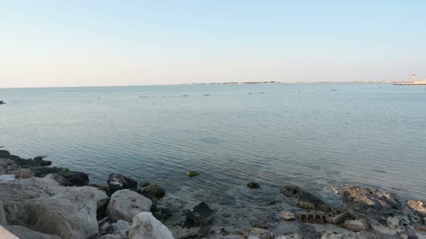 Half Moon Beach in the city of Khobar in Dammam, the stunning sunrise view over the beach, the nature in the city of Khobar in the Kingdom of Saudi Arabia, tourist attractions.
