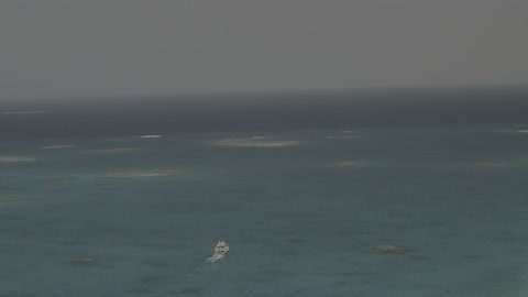 A famous coastal area in the Kingdom of Saudi Arabia, boats and ships in the Arabian Gulf, aerial drone photography of a ship sailing in the White Island in the city of Jeddah, a recreational tourist trip in the Red Sea, a destination to attract and draw tourists from around the world.