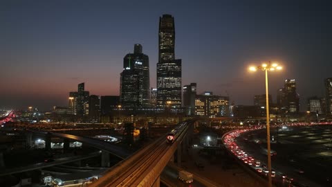 Famous tourist attractions in Saudi Arabia, the towers and skyscrapers in the Kingdom, traffic on King Fahd Road, the economic and urban renaissance of Riyadh in Saudi Arabia, the architectural engineering art in Riyadh at sunset.