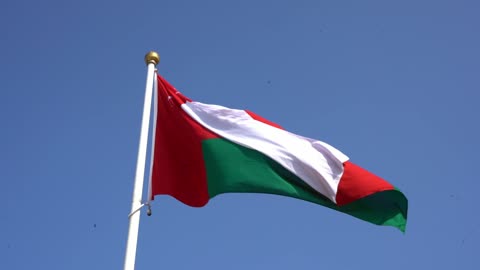 Celebrating national holidays and occasions, love for the homeland and belonging to it, the flag of the Sultanate of Oman flutters in the sky of the country, celebrating the anniversary of Oman's National Day on November 18, commemorating the founding of the state in 1775 AD, pride and honor in the symbols and the flag.