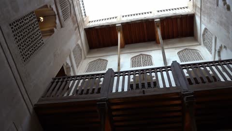 A historical military archaeological site, an interior view of the Bahla Fort in Ibri made of mud in the Sultanate of Oman, featuring design and architectural engineering in the ancient geometric style, famous heritage tourist landmarks.