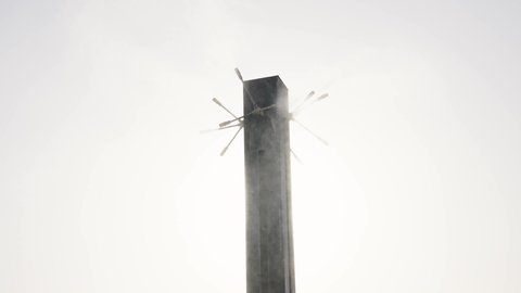 Using misting fans to humidify the air, cafes and restaurants serving delicious food, entertainment cities and landmarks in Saudi Arabia, leisure and recreation, attracting tourists from all over the world, tourism in Saudi Arabia, a backdrop of towers and skyscrapers