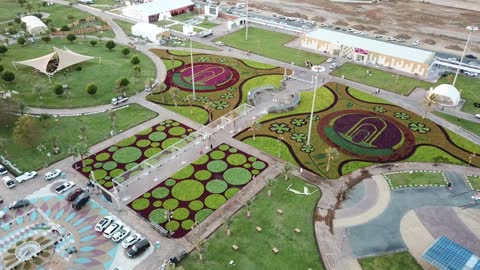 Highlighting agricultural production, tourist natural places and parks, showcasing various types of fruits and blooming flowers in different shapes and colors, caring for gardens and the fertile nature in the Kingdom, drone photography of the Rose and Fruit Festival in the city of Tabuk, enjoying family entertainment activities.