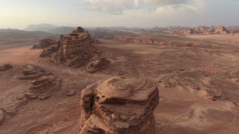 A protected desert wilderness area, drone photography of the Shuqri Mountains in Tabuk, Saudi Arabia, mountain formations, Shuqri Rift, mountains and highlands, desert terrain, mountainous nature, mountain fault, natural landmarks of Tabuk, tourism in Saudi Arabia.
