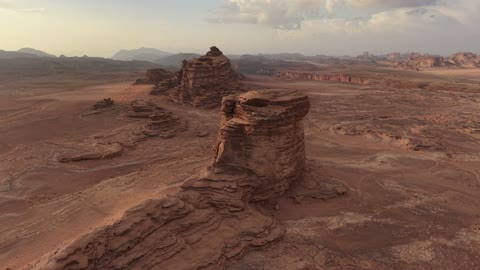 A protected desert wilderness area, drone photography of the Shuqri Mountains in Tabuk, Saudi Arabia, mountain formations, Shuqri Rift, mountains and highlands, desert terrain, mountainous nature, mountain fault, natural landmarks of Tabuk, tourism in Saudi Arabia.