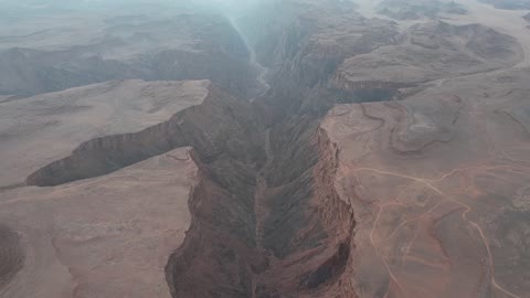 Low rainfall or surface water, drone photography of Shak Shuqri in Tabuk, Saudi Arabia, mountain formations, Shak Shuqri, mountains and highlands, desert terrain, mountainous nature, mountain fault, natural landmarks of Tabuk, tourism in Saudi Arabia.