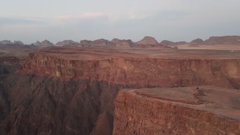 Shuqri Mountains is a distinctive geological site in Tabuk, drone photography of Shuqri Mountains in Tabuk, Saudi Arabia, mountain formations, Shuqri Rift, mountains and highlands, desert terrain, mountainous nature, mountain fault, natural landmarks of Tabuk, tourism in Saudi Arabia.