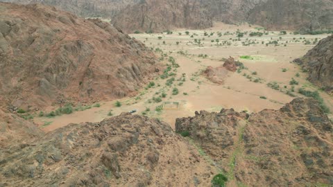The Aja Mountains in the city of Hail, the natural landscapes and tourist attractions in the Kingdom of Saudi Arabia, aerial drone photography of the rugged terrain of the Aja Mountains in Tuwaran, the peaks and highlands in the mountainous areas, nature background.