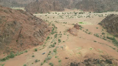 The Aja Mountains in the city of Hail, the natural landscapes and tourist attractions in the Kingdom of Saudi Arabia, aerial drone photography of the rugged terrain of the Aja Mountains in Tuwaran, the peaks and highlands in the mountainous areas, nature background.