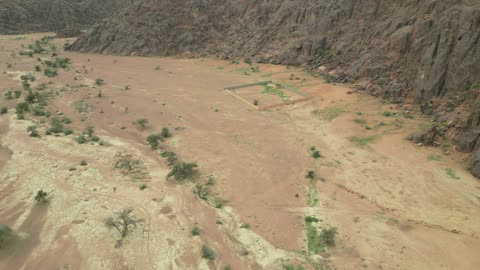 The Aja Mountains in the city of Hail, the natural landscapes and tourist attractions in the Kingdom of Saudi Arabia, aerial drone photography of the rugged terrain of the Aja Mountains in Tuwaran, the peaks and highlands in the mountainous areas, nature background.