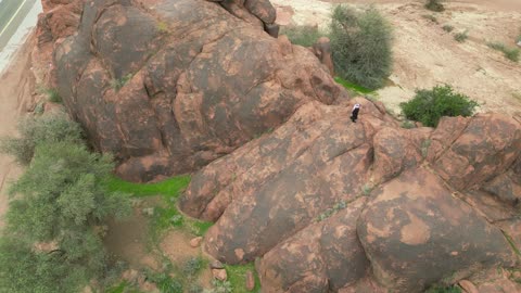 The desert nature, Aja Mountains in the city of Hail, tourist attractions in the Kingdom of Saudi Arabia, aerial drone photography of the rugged terrain of Aja Mountains in Tuwaran, the peaks and highlands in the mountainous areas, nature background.