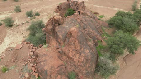 The Aja Mountains in the city of Hail, the natural landscapes and tourist attractions in the Kingdom of Saudi Arabia, aerial drone photography of the rugged terrain of the Aja Mountains in Tuwaran, the peaks and highlands in the mountainous areas, nature background.