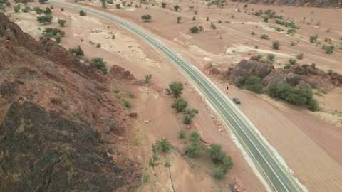 Tourist natural places, the Aja Mountains in the city of Hail in the Kingdom of Saudi Arabia, aerial drone photography of the rugged terrain of the Aja Mountains in Tuwaran, the peaks and highlands in the mountainous areas, nature background.