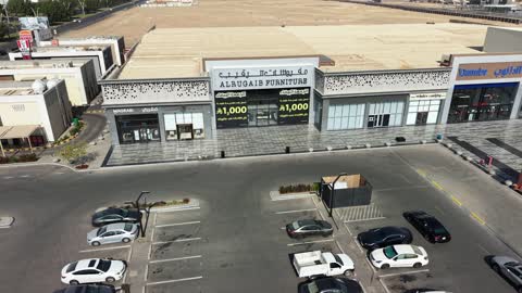 Practicing hobbies and entertaining games, a place for play and fun and spending enjoyable time, modern and advanced architectural engineering art in the Kingdom of Saudi Arabia, distinctive cafes and play areas, drone photography of billiards and cafes in Tabuk on Prince Fahd bin Sultan Road in the city of Tabuk during the daytime.