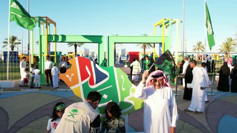 The manuscript is our home, celebrations and festivals in the Kingdom of Saudi Arabia, the celebration of the Saudi National Day on September 23, bringing people together and holding festive events in parks, gardens, and public places, happy holidays and national occasions.