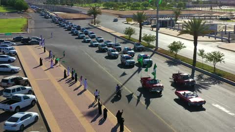 The traffic movement of cars in the streets of the Kingdom, celebrations and festivals in the Kingdom of Saudi Arabia, the celebration of the Saudi National Day on September 23, organizing festive events in parks and public places, happy holidays and national occasions.
