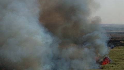 Smoke from the fire and flames rising from the agricultural lands in the Tabuk region, a natural tourist area in the Kingdom of Saudi Arabia, are the effects of global warming and the burning of green spaces.
