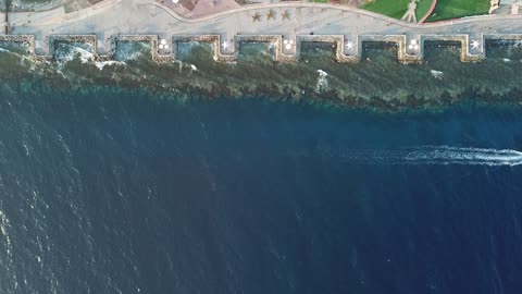 Water landscapes, the progress and urban development of Saudi Arabia, attractions for visitors to the coastal city of Duba, famous landmarks and tourist places, aerial drone photography of the Duba Sea Corniche, the waterfront in the Kingdom of Saudi Arabia during the day.