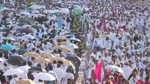Places and landmarks of sacred Islamic religious significance, the spiritual atmosphere during the performance of the greatest pillar of Hajj, aerial drone footage of pilgrims of the Sacred House of Allah wearing the Ihram clothing at Mount Arafat (Mount of Mercy) in Mecca, the Hajj season in Saudi Arabia, worship and drawing closer to Allah Almighty.