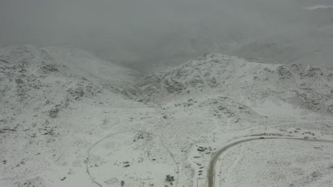 Cold snowy atmosphere, a distinguished archaeological geographic site, the snow-covered Al-Lawz Mountains in the Trojena area, sculpted mountains and rock formations in the city of Tabuk, cultural and tourist landmarks in the Kingdom of Saudi Arabia, aerial drone photography of rock formations in a village in Jeddah, Neom, in the western part of the Kingdom of Saudi Arabia.