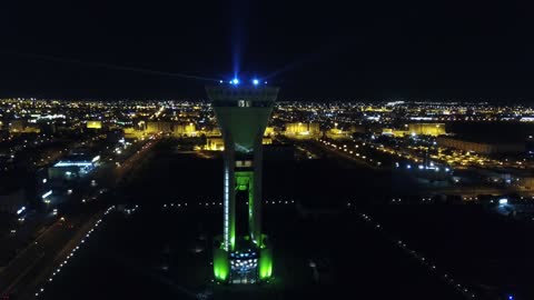 The beauty of Saudi Arabia, Saudi tourism, landmarks of the city of Tabuk, the Tabuk Tower in Saudi Arabia, one of the most prominent architectural and tourist landmarks in the city of Tabuk in the Kingdom of Saudi Arabia, aerial drone photography of the Tabuk Tower at night, a tourist attraction in Saudi Arabia, was used in the past to store and cool water.