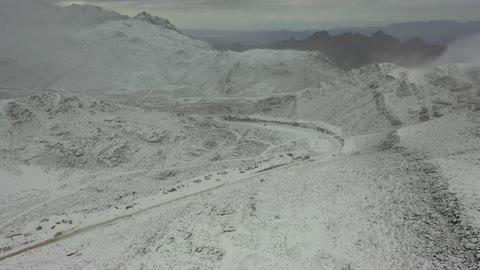 Cold snowy atmosphere, a distinguished archaeological geographic site, the snow-covered Al-Lawz Mountains in the Trojena area, sculpted mountains and rock formations in the city of Tabuk, cultural and tourist landmarks in the Kingdom of Saudi Arabia, aerial drone photography of rock formations in a village in Jeddah, Neom, in the western part of the Kingdom of Saudi Arabia.