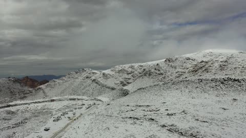 Winter atmosphere on the peaks and mountain heights, the snow-covered Al-Lawz mountain range in the Trojena area, sculpted mountains and geological formations in the city of Tabuk, cultural and tourist landmarks in the Kingdom of Saudi Arabia, aerial drone photography of rock formations in a village in Jeddah, Neom, in the west of the Kingdom of Saudi Arabia.