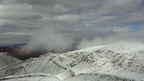 Winter atmosphere, the Al-Lawz mountain range in the Trojena area is covered in snow, sculpted mountains and rock formations in the city of Tabuk, cultural and tourist landmarks in the Kingdom of Saudi Arabia, snowfall, a low-pressure system, aerial drone photography of rock formations in a village in Jeddah, Neom, in the western part of the Kingdom of Saudi Arabia.