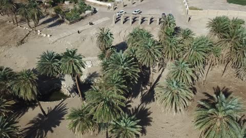 The beauty of the natural landscapes in Saudi Arabia, the flow of water in springs and lakes, historical religious tourist landmarks, the attention to the vast green spaces in the Kingdom of Saudi Arabia, the planting of trees and natural green plants, drone photography of Moses' Springs in the city of Neom in Tabuk.