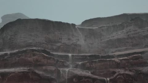 Floods, waterfalls, and cold winter atmospheres, mountain peaks and highlands, rock formations in the Jeddah area in the northwest of the Kingdom of Saudi Arabia, the NEOM tourism project, landscapes of golden sands, tourist attractions in the Kingdom of Saudi Arabia.