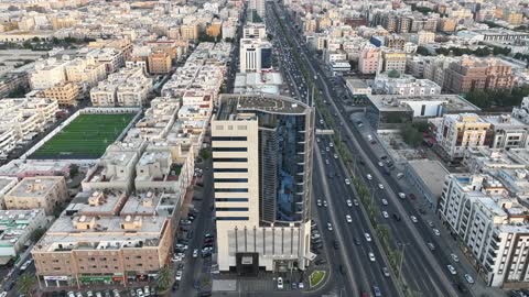 The streets and paved roads in the city of Jeddah, the architectural engineering design of the roads in the city of Jeddah, the traffic of cars on the roads of the Kingdom of Saudi Arabia, a view of the sunset in the streets of Saudi Arabia.